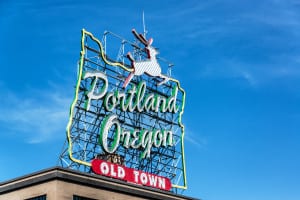 Iconic Portland, Oregon Old Town sign with an outline of Oregon and a stag